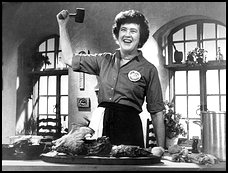 Julia Child wielding a mallet.